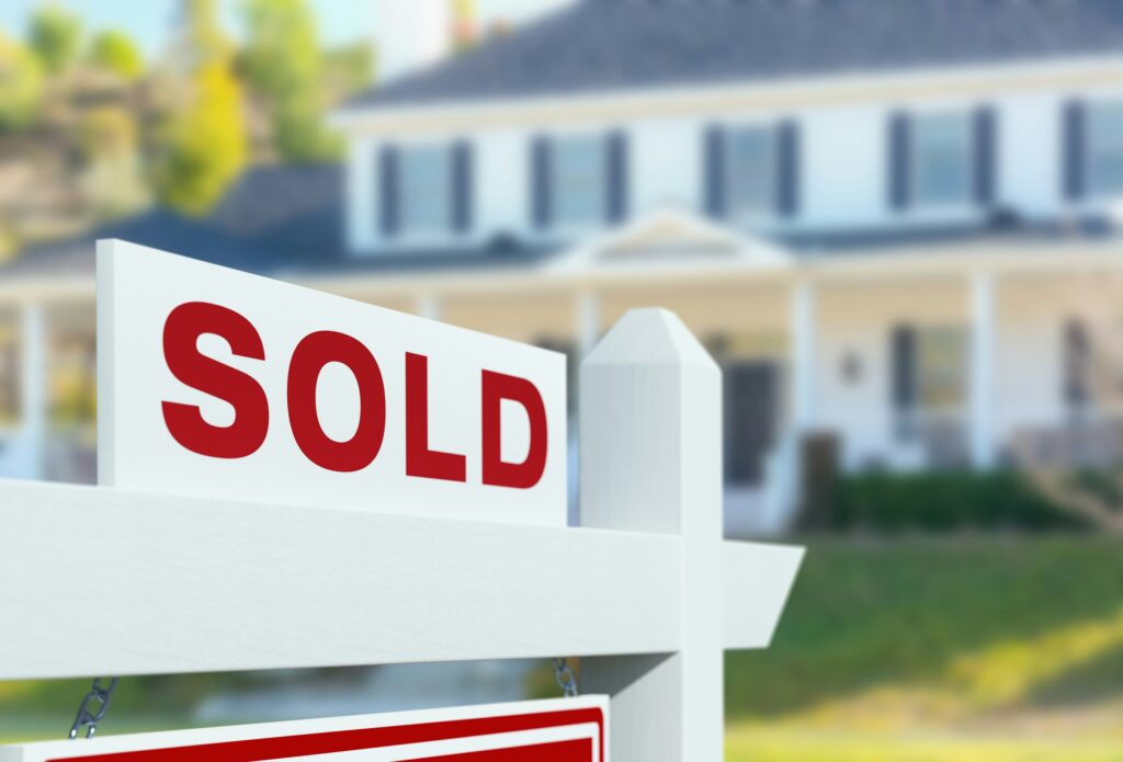 Sold sign outside a home following an inherited property appraisal and sale