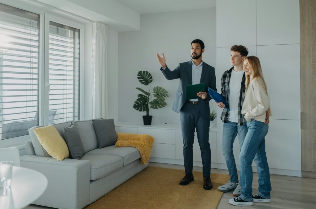 Appraiser explaining the second appraisal process to homeowners during a valuation review.